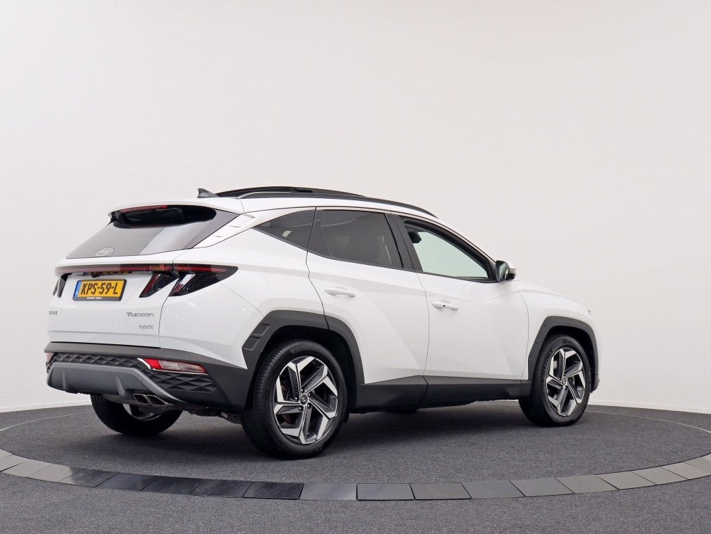 Hyundai Tucson 1.6 T-GDI HEV Premium Sky | Panoramadak | Mem, Gebruikt, 4 cilinders, 1650 kg, Wit