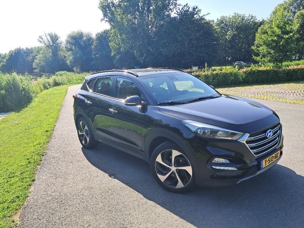 Hyundai Tucson 1.6 T-GDI 177PK 2WD Zwart Full Option, Auto's, Voorwielaandrijving, Dealer onderhouden, 4 cilinders, Zwart