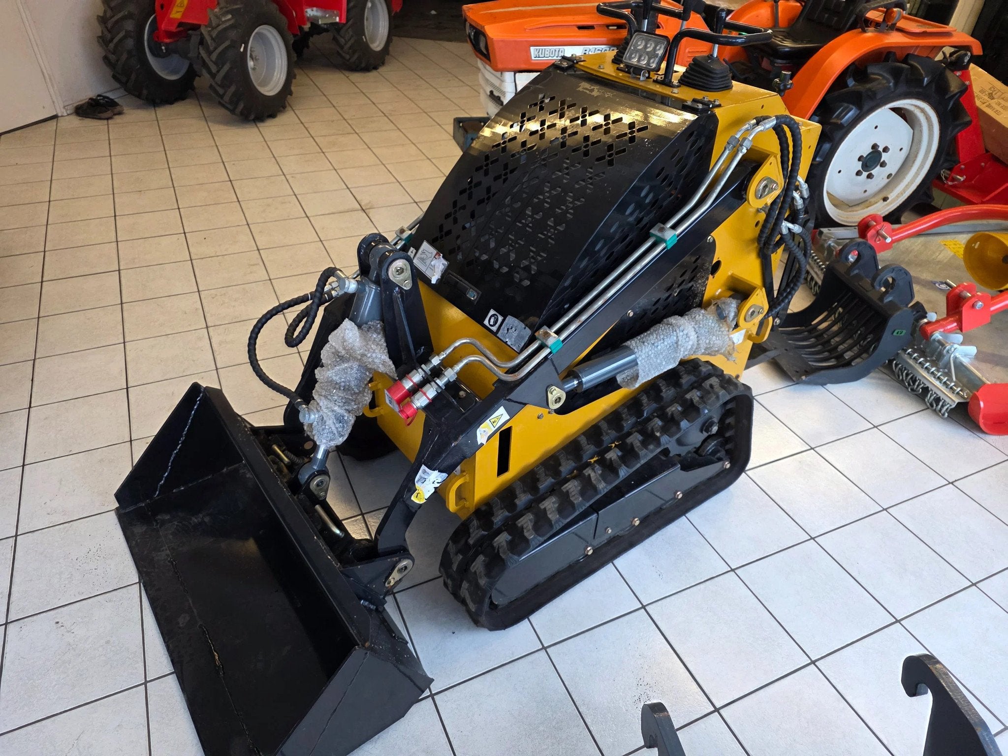 Briggs en Stratton Schranklader skidster ramrod loader shove, Wiellader of Shovel