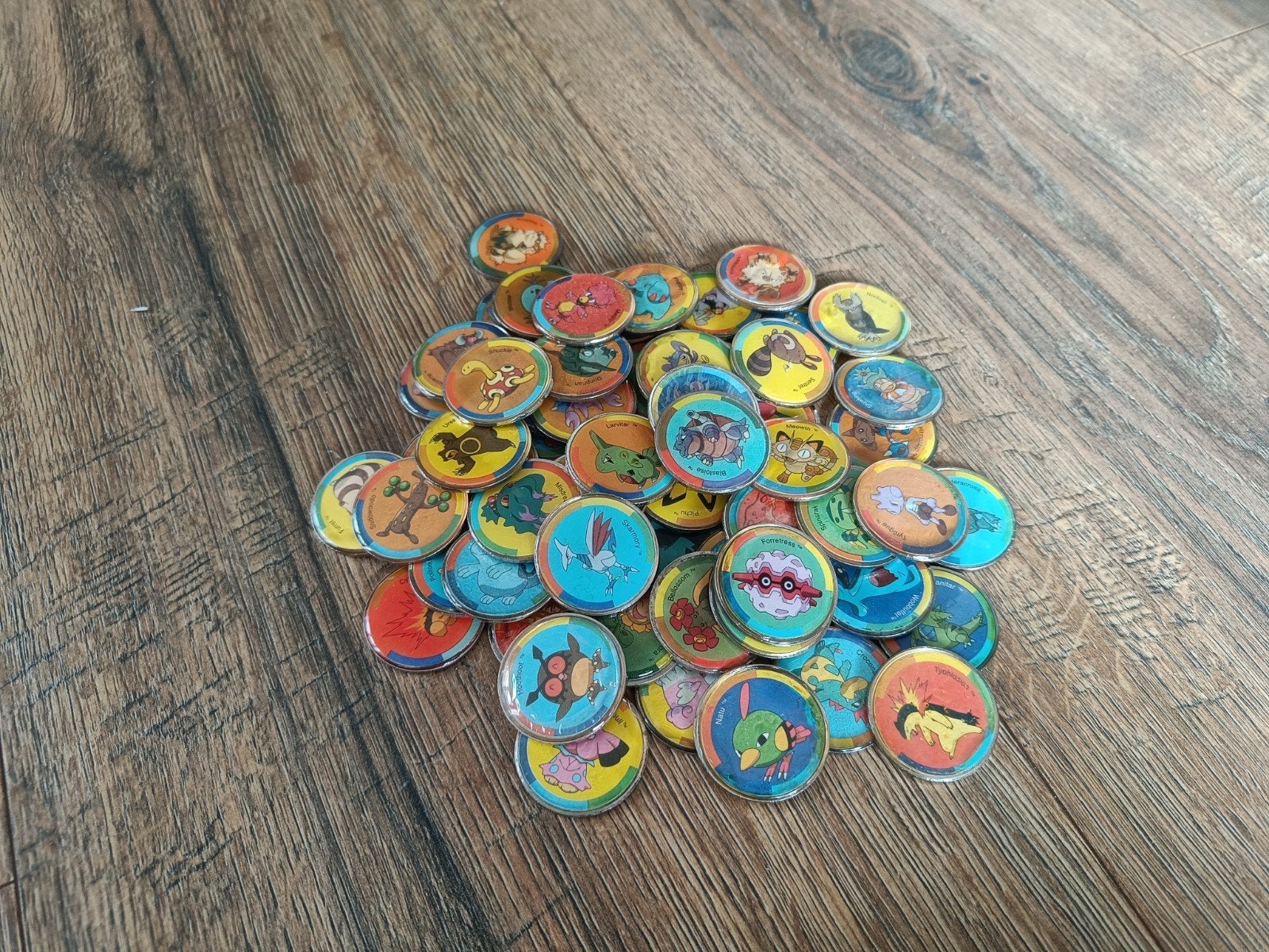 60 Pokémon munten uit 2001 - Zeldzame chips zak promotie, Ophalen of Verzenden, Gebruikt, Overige typen