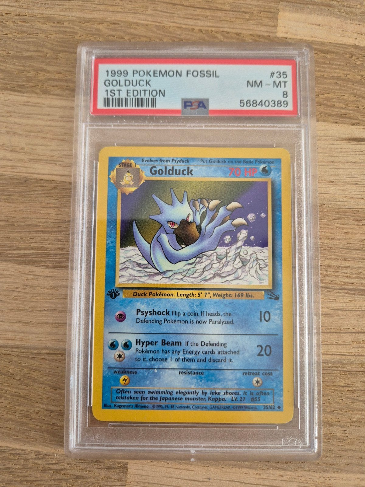 Pokémon Fossil Golduck 1st Edition PSA 8 NM-MT, Ophalen of Verzenden, Zo goed als nieuw, Losse kaart