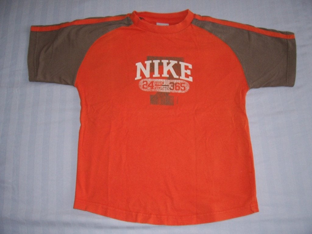 Oranje / beige shirt Nike maat 140, Kinderen en Baby's, Kinderkleding | Maat 140, Ophalen of Verzenden, Gebruikt, Jongen, Shirt of Longsleeve