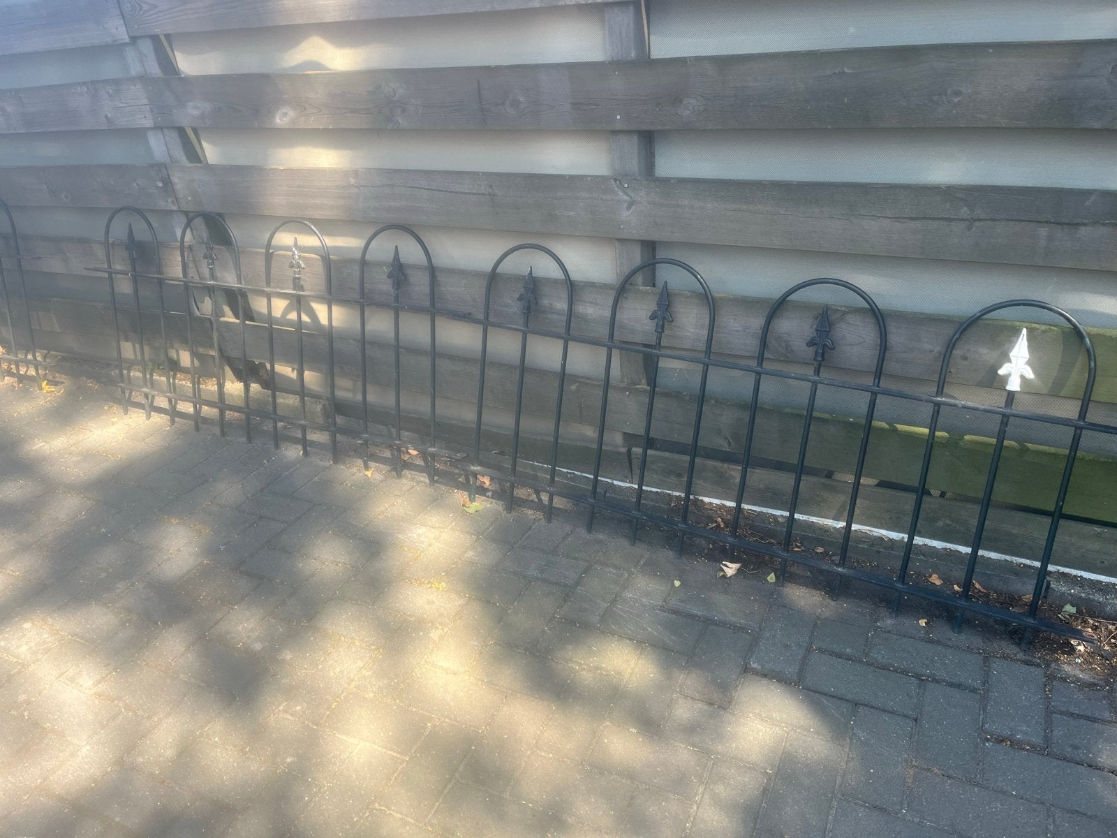 Zwart sierhekwerk - 2 delen, Tuin en Terras, Tuinhekken en Hekwerk, Ophalen of Verzenden, Gebruikt, IJzer, Sierhekwerk