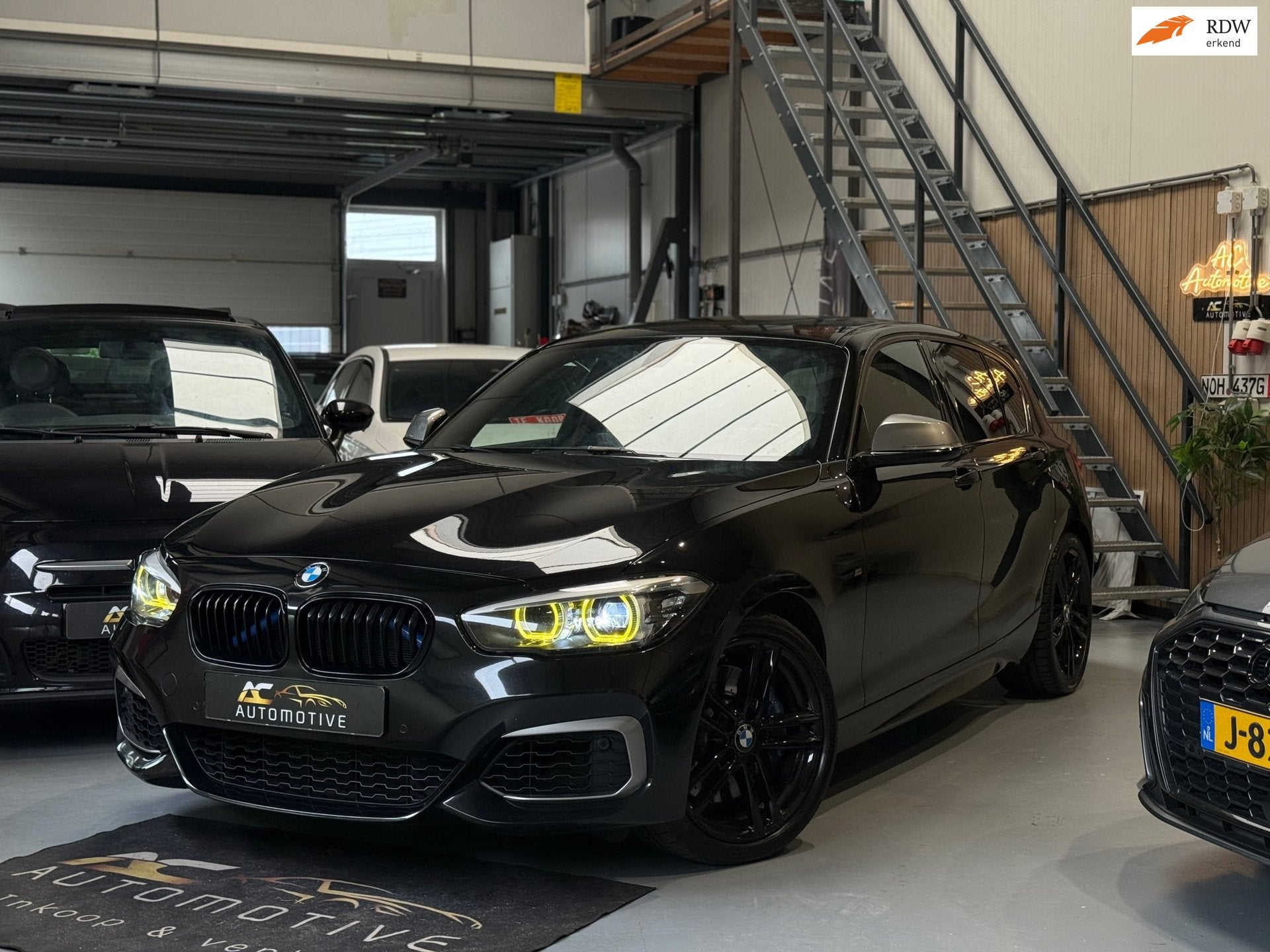 BMW 1-serie M140i xDrive High Executive Harman/Kardon, Auto's, Gebruikt, Euro 6, Leder, Bedrijf