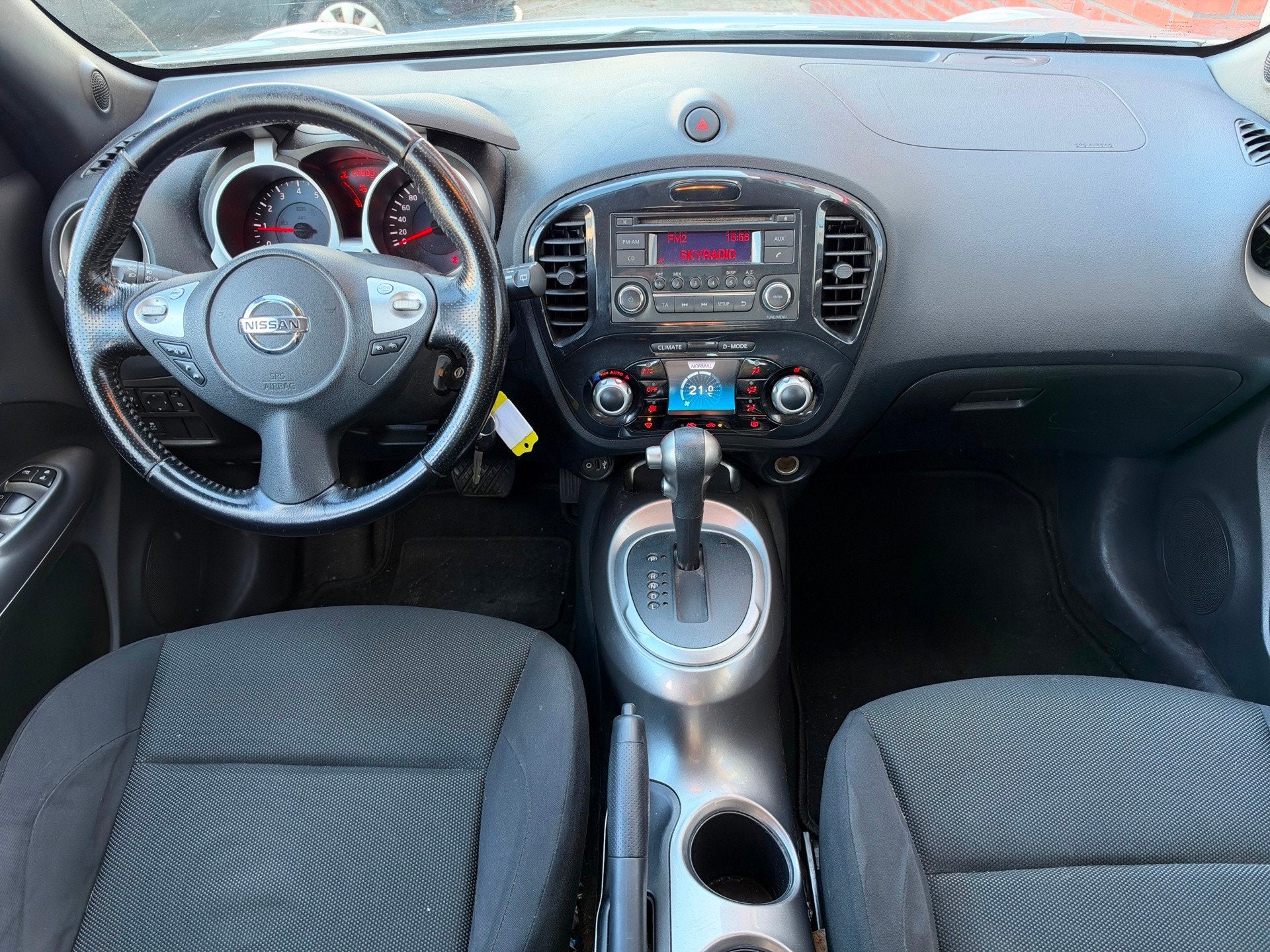 Nissan Juke 1.6 Acenta / PDC / AUT / Clima / Cruise / LM / N, Auto's, Euro 5, Stof, 4 cilinders, Met garantie (alle)
