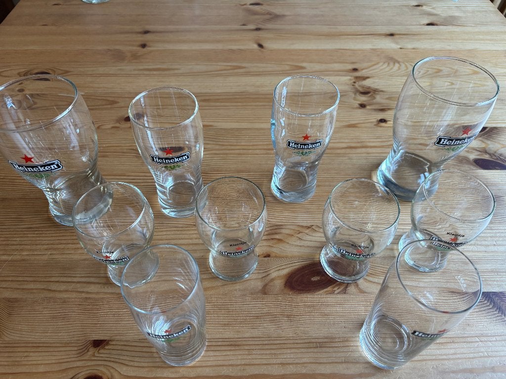 Set van 9 Heineken bierglazen, Ophalen of Verzenden, Zo goed als nieuw, Bierglas