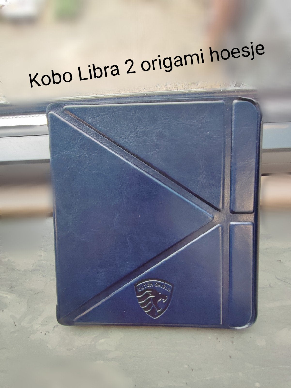 Kobo Libra 2 ereader marine blauw origami hoesje, Ophalen of Verzenden, Nieuw, 7 inch, Dutch shield