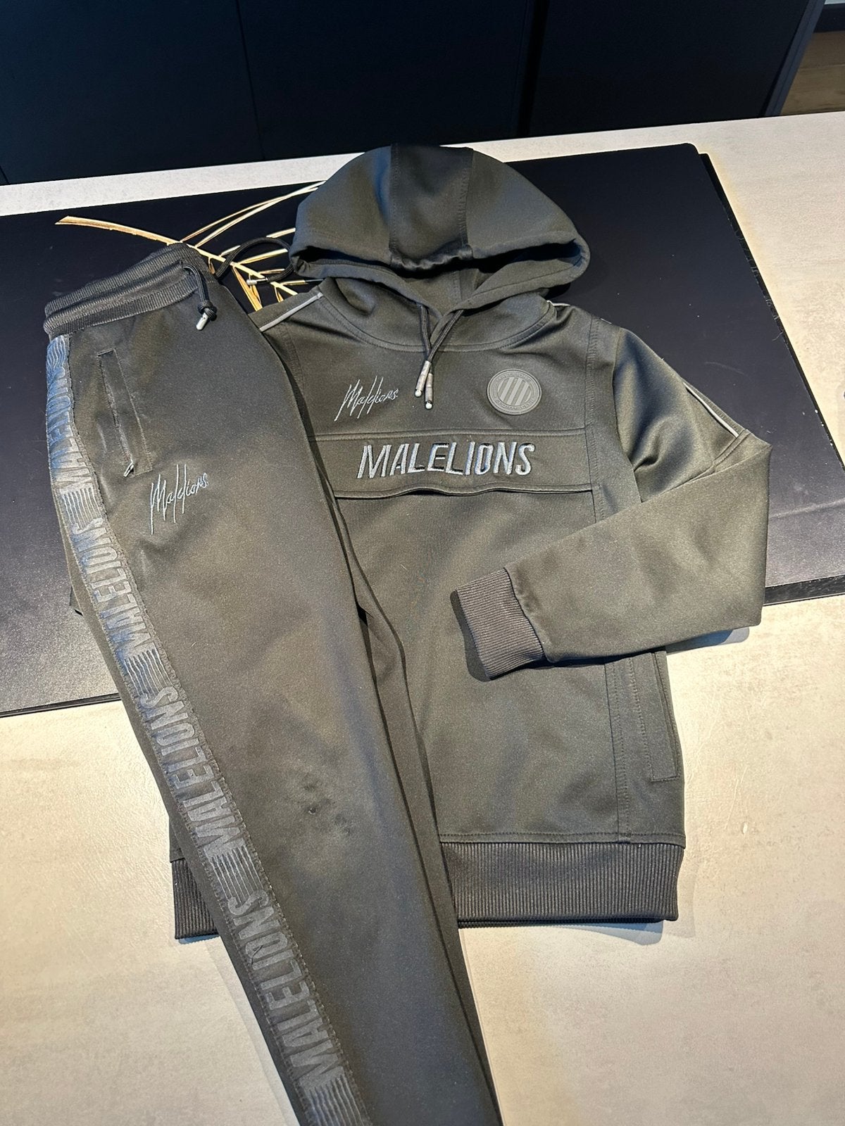 Malelions sportpak zwart maat 140, Ophalen of Verzenden, Zo goed als nieuw, Jongen, Sport- of Zwemkleding