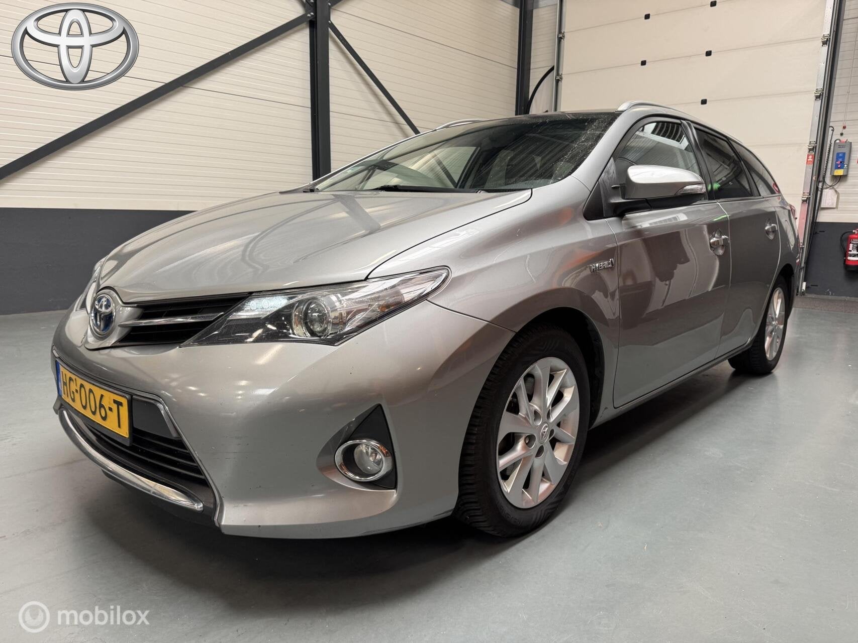 Toyota Auris TS 1.8 Hybrid Lease Navi|Pano|Camera|Dealer aut, Auto's, Toyota, Euro 5, Gebruikt, Zwart, Origineel Nederlands