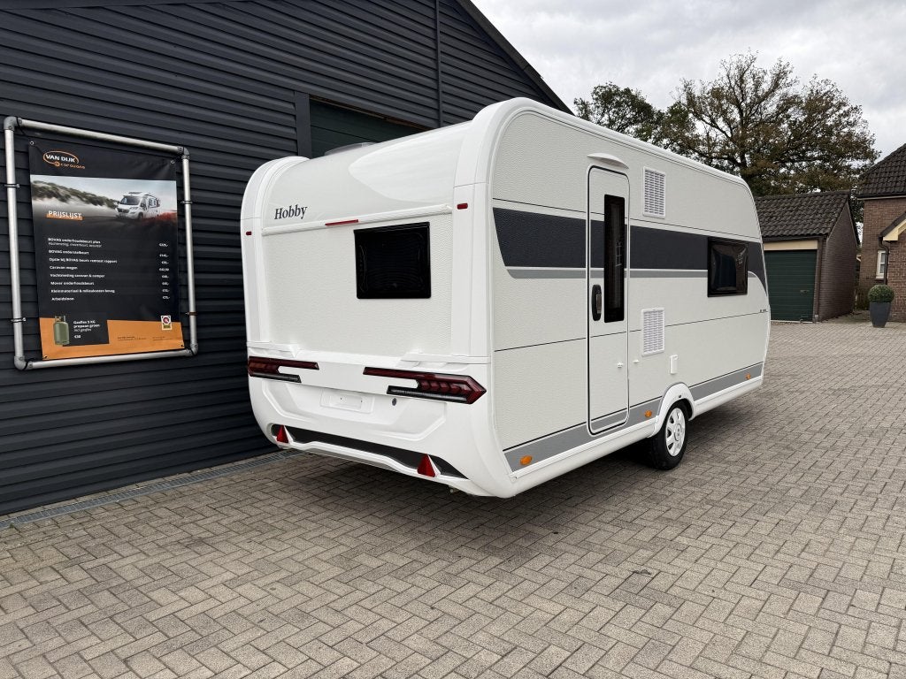 Hobby De Luxe 460 sff 2026 queens bed , zware as, Caravans en Kamperen, Caravans, Standaardzit, Hobby, Schokbreker, Bedrijf
