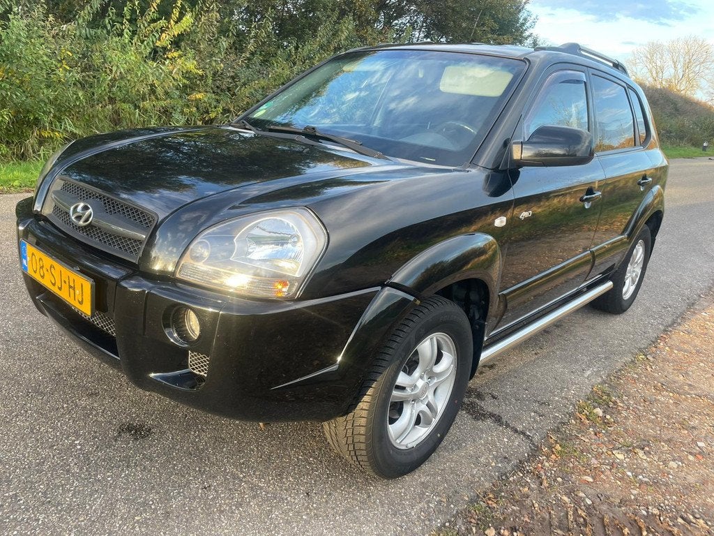 Hyundai Tucson 2.0i 4WD Style, Auto's, Hyundai, Gebruikt, 4 cilinders, Zwart, Bedrijf