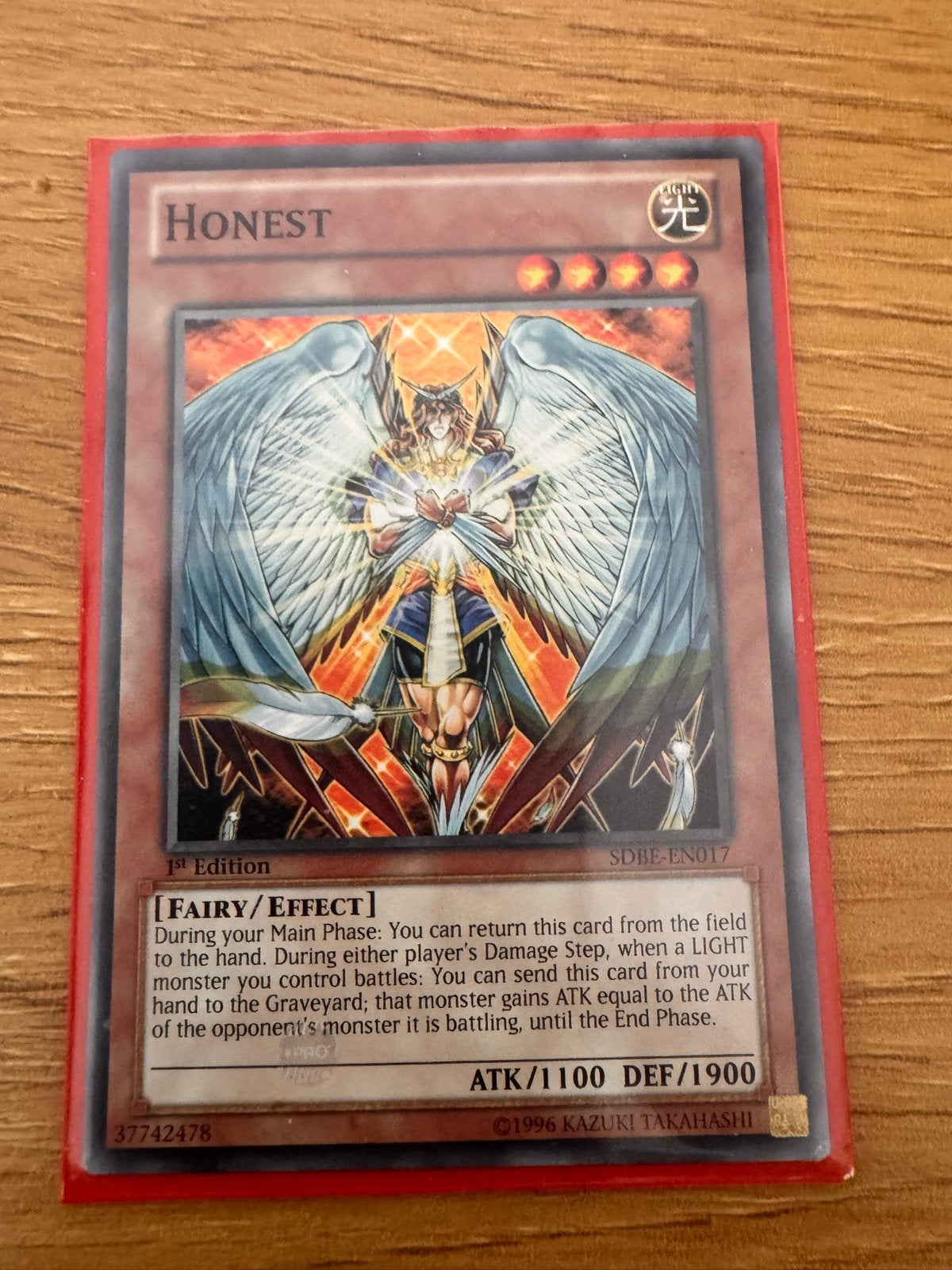 Yu-Gi-Oh! Honest (1st Edition) SDBE-EN017, Hobby en Vrije tijd, Verzamelkaartspellen | Magic the Gathering, Verzenden, Gebruikt