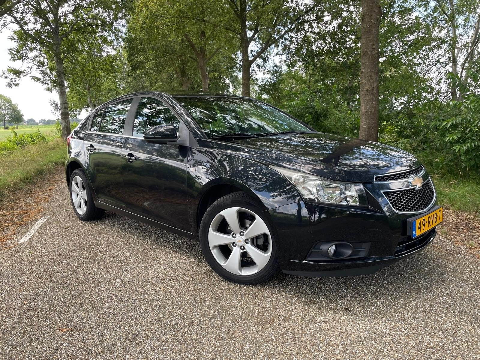 Chevrolet Cruze 1.8 5DRS 2011 Zwart, Auto's, Voorwielaandrijving, 15 km/l, 4 cilinders, 1796 cc