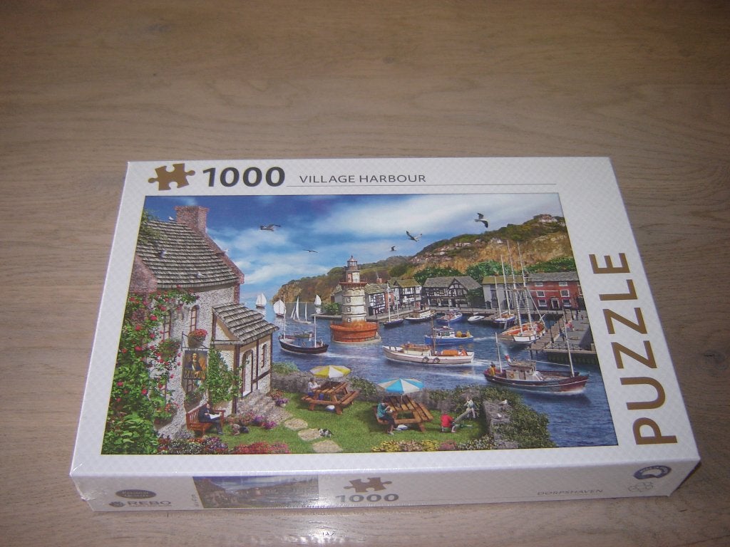 Puzzel Rebo DORPSHAVEN 1000 st. NIEUW IN DE FOLIE !, Ophalen of Verzenden, 500 t/m 1500 stukjes, Nieuw, Legpuzzel