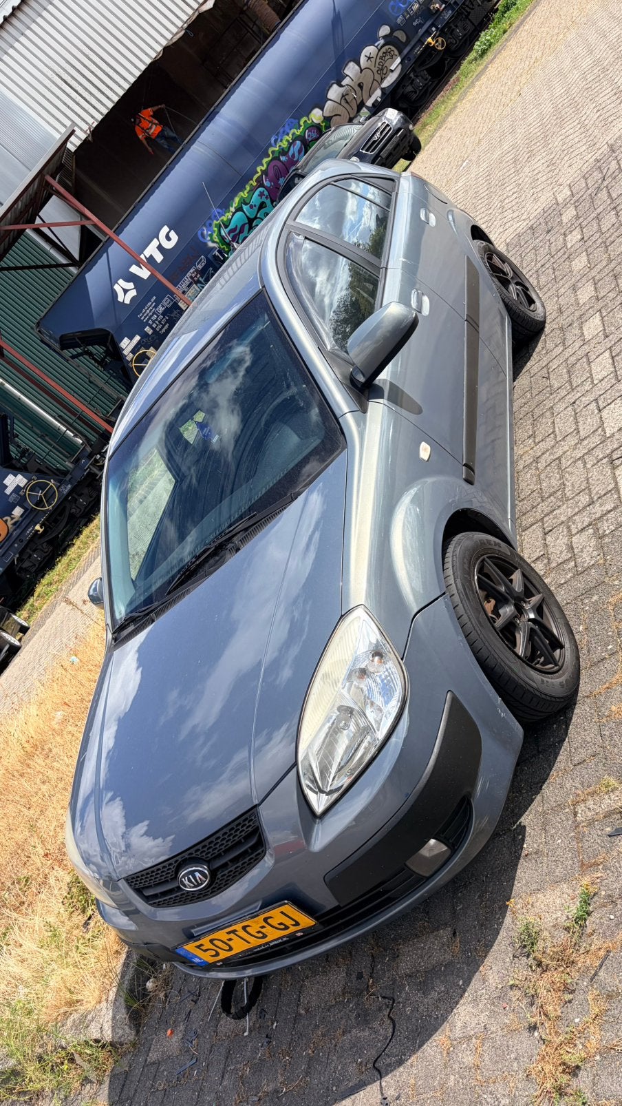 Kia Rio 1.4 HB AUT 2006 Grijs, Auto's, Kia, Bedrijf, Rio, Airbags, Airconditioning, Alarm, Bluetooth, Elektrische ramen, Radio