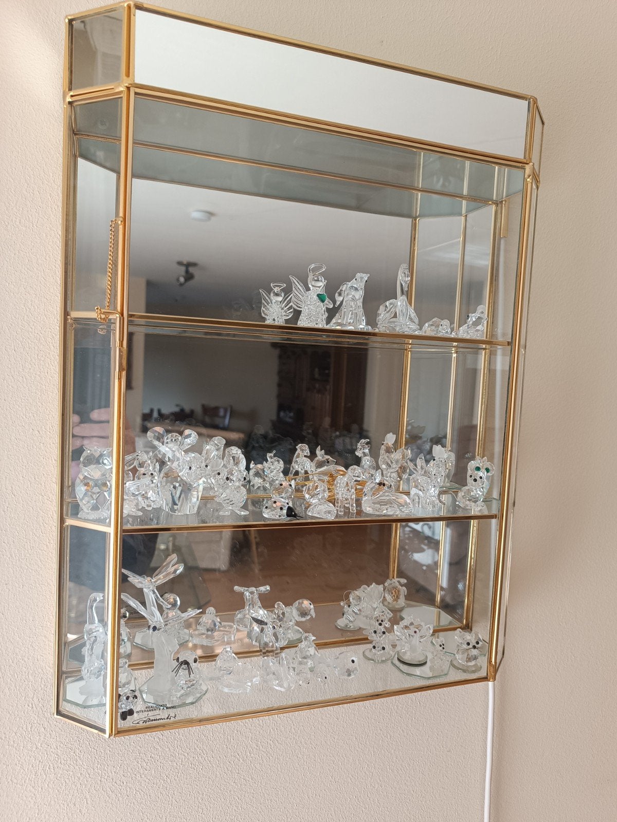 Swarovski beeldjes + kastje, Ophalen