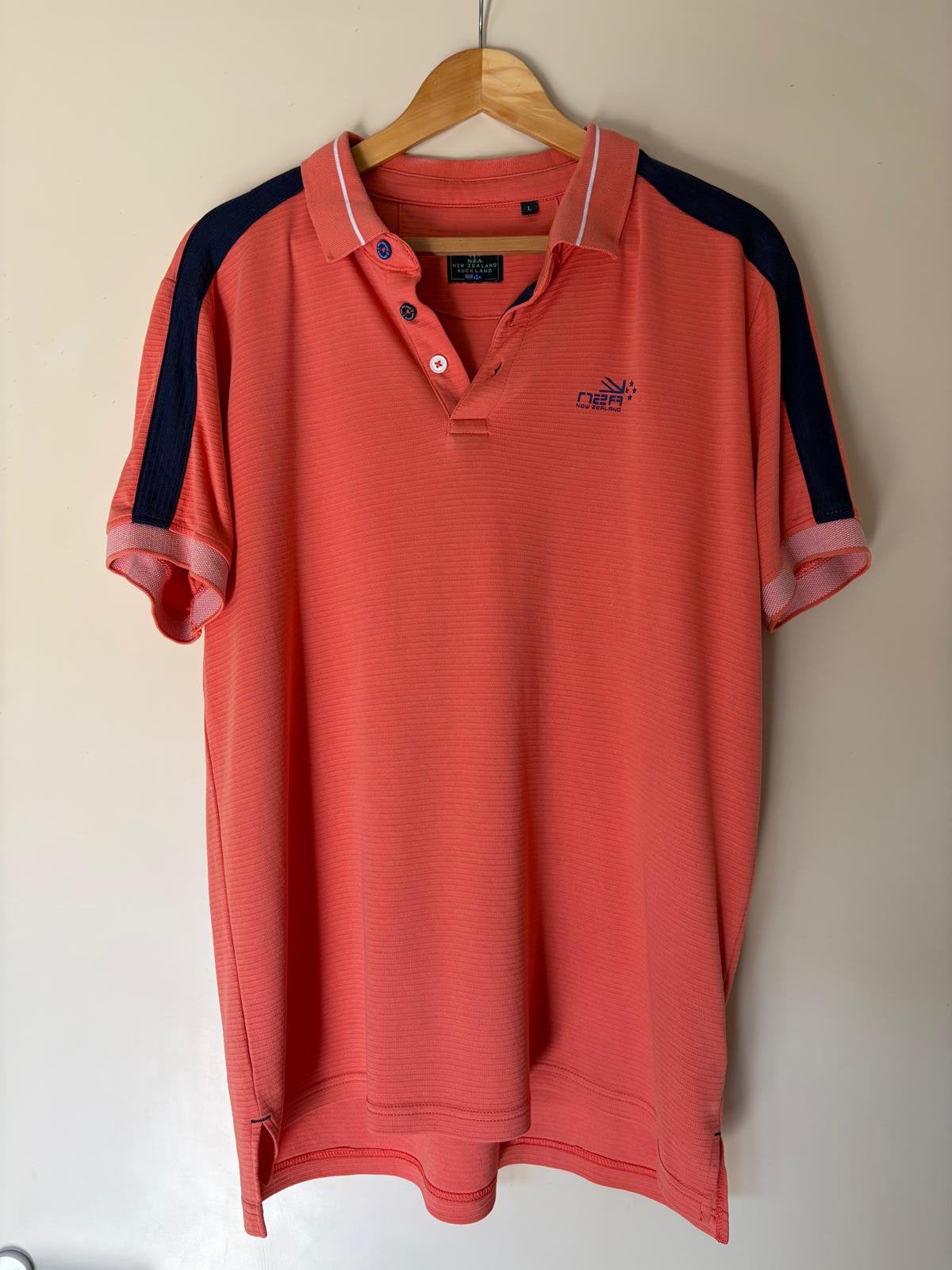 New Zealand Auckland polo, Ophalen of Verzenden, Zo goed als nieuw, Maat 52/54 (L), Oranje