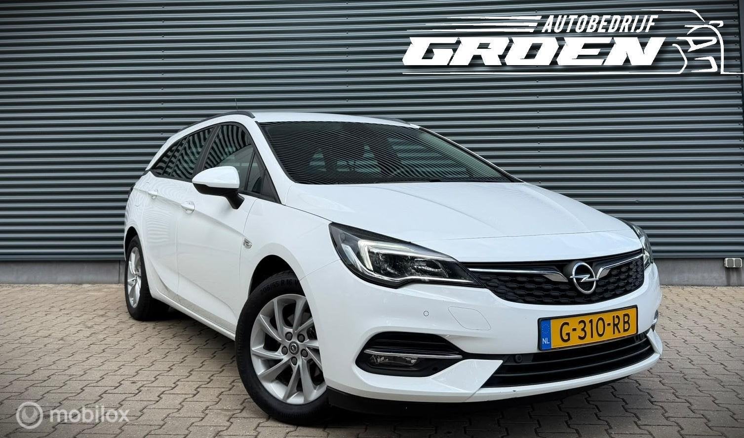 Opel Astra Sports Tourer 1.2 Edition NAP|TREKHAAK|PDC|CAMERA, Gebruikt, Euro 6, 1199 cc, Wit