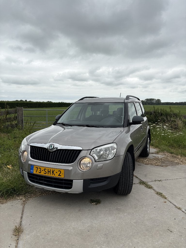 Skoda Yeti 1.2TSI 77KW H6 2011 Beige, Auto's, Skoda, Voorwielaandrijving, Euro 5, Stof, 4 cilinders