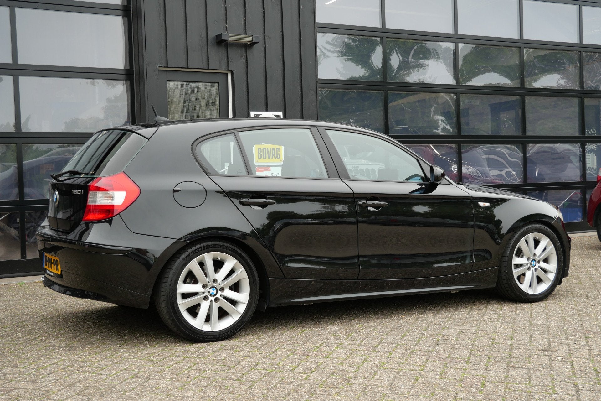 BMW 1-serie 130i 266 PK Introduction | Handgeschakeld | NL-A, Auto's, BMW, Achterwielaandrijving, Gebruikt, 1350 kg, Handgeschakeld
