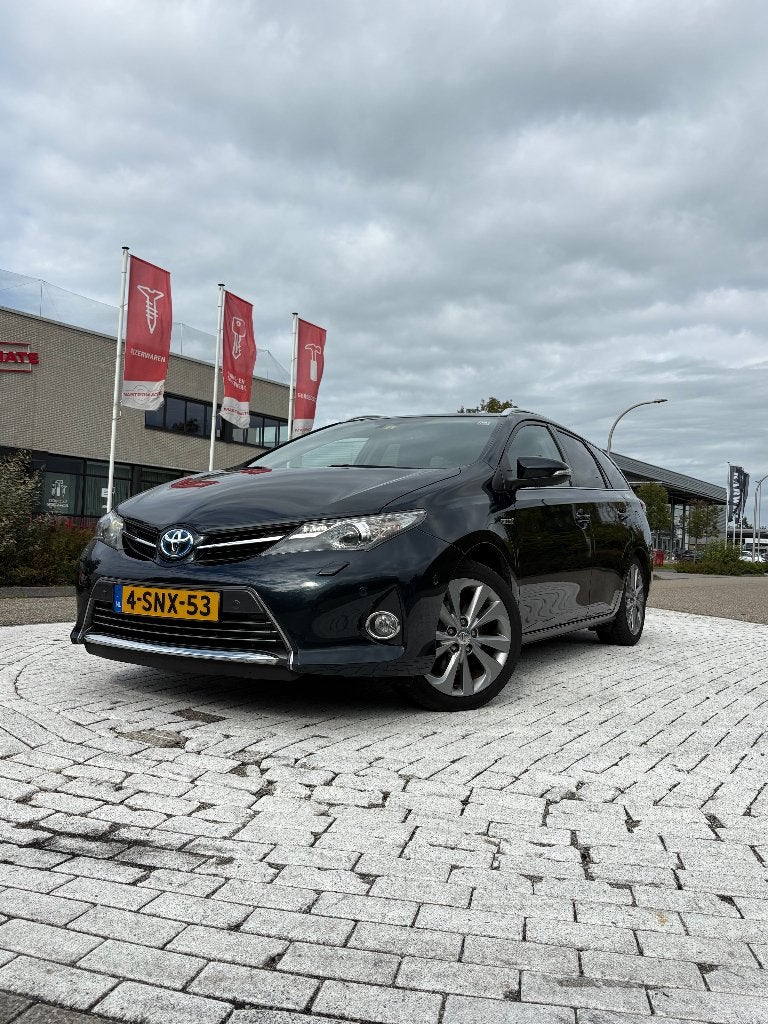 Toyota Auris Touring Sports 1.8 Hybrid Automaat Lease Pro, Auto's, Dealer onderhouden, Zwart, 345 kg, Blauw
