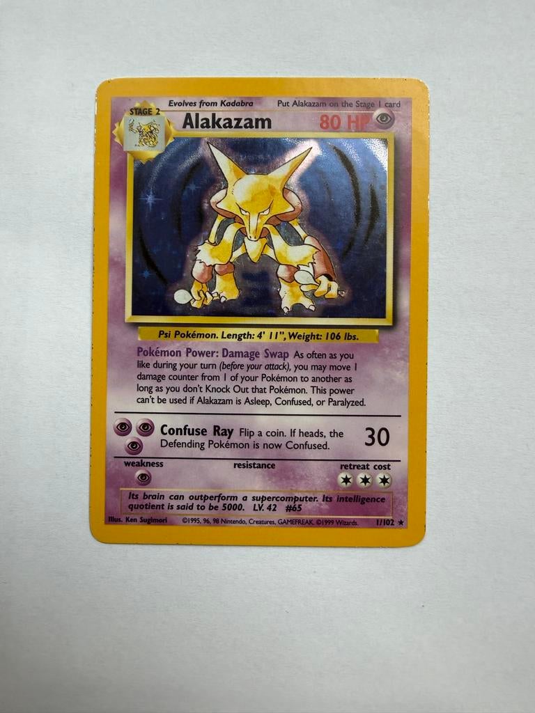 Alakazam Pokémon kaart 1/102 Base Set Holo, Ophalen of Verzenden, Zo goed als nieuw, Losse kaart