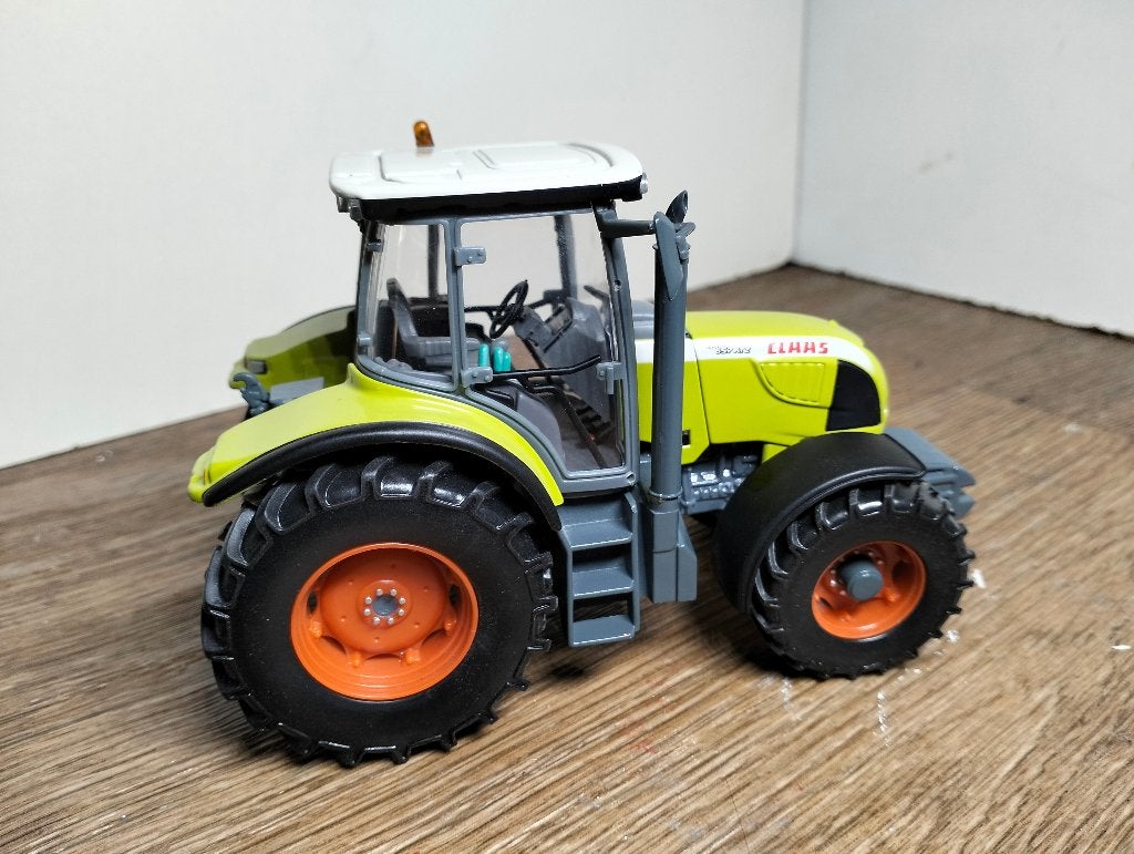 Te koop UH Claas Ares 657 ATZ .(A), Ophalen of Verzenden, Zo goed als nieuw, Tractor of Landbouw, Universal Hobbies
