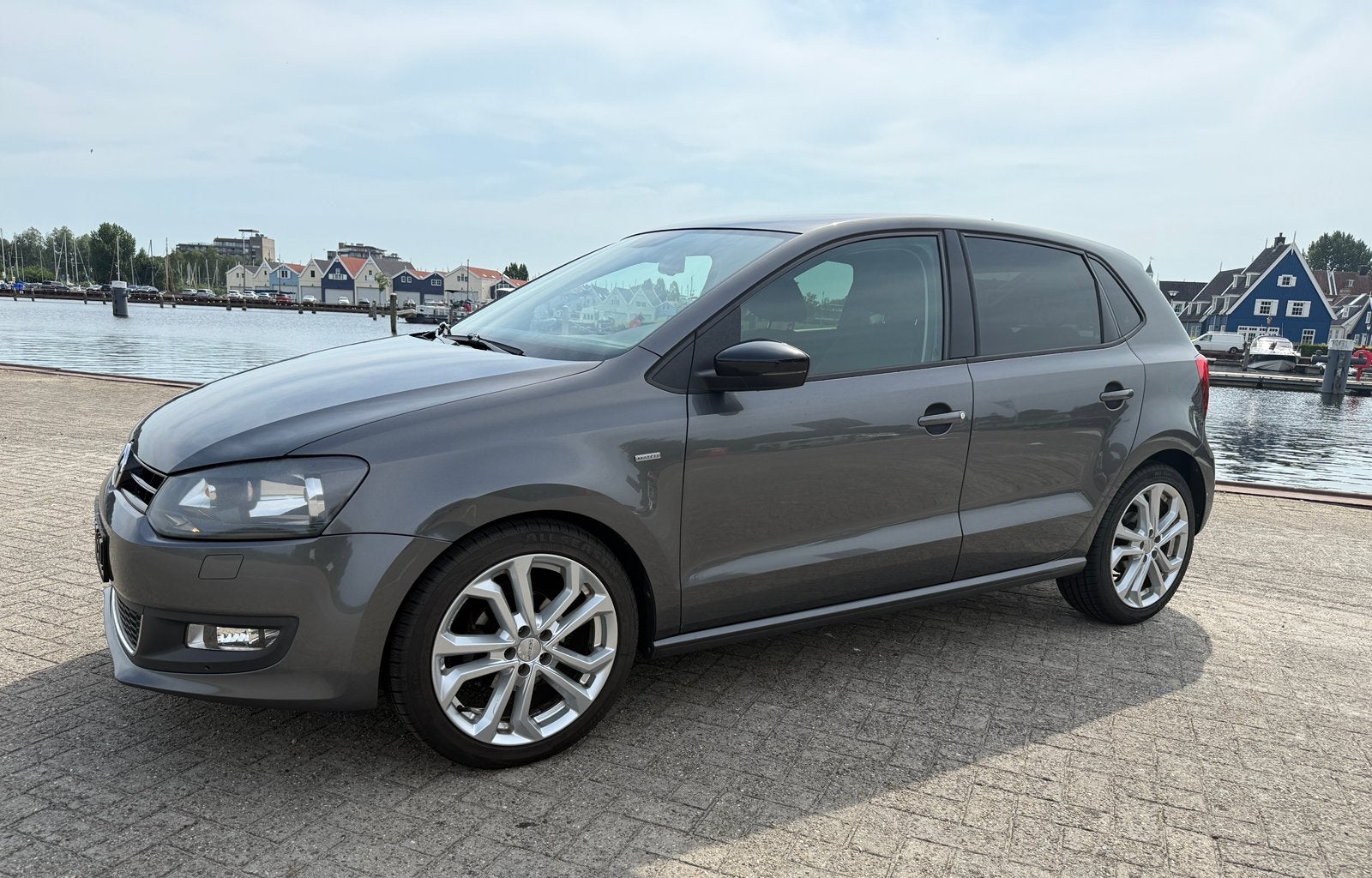 Volkswagen Polo 1.4-16V Highline Match Automaat 2012, Auto's, Volkswagen, Euro 5, Stof, 40 €/maand, Zwart