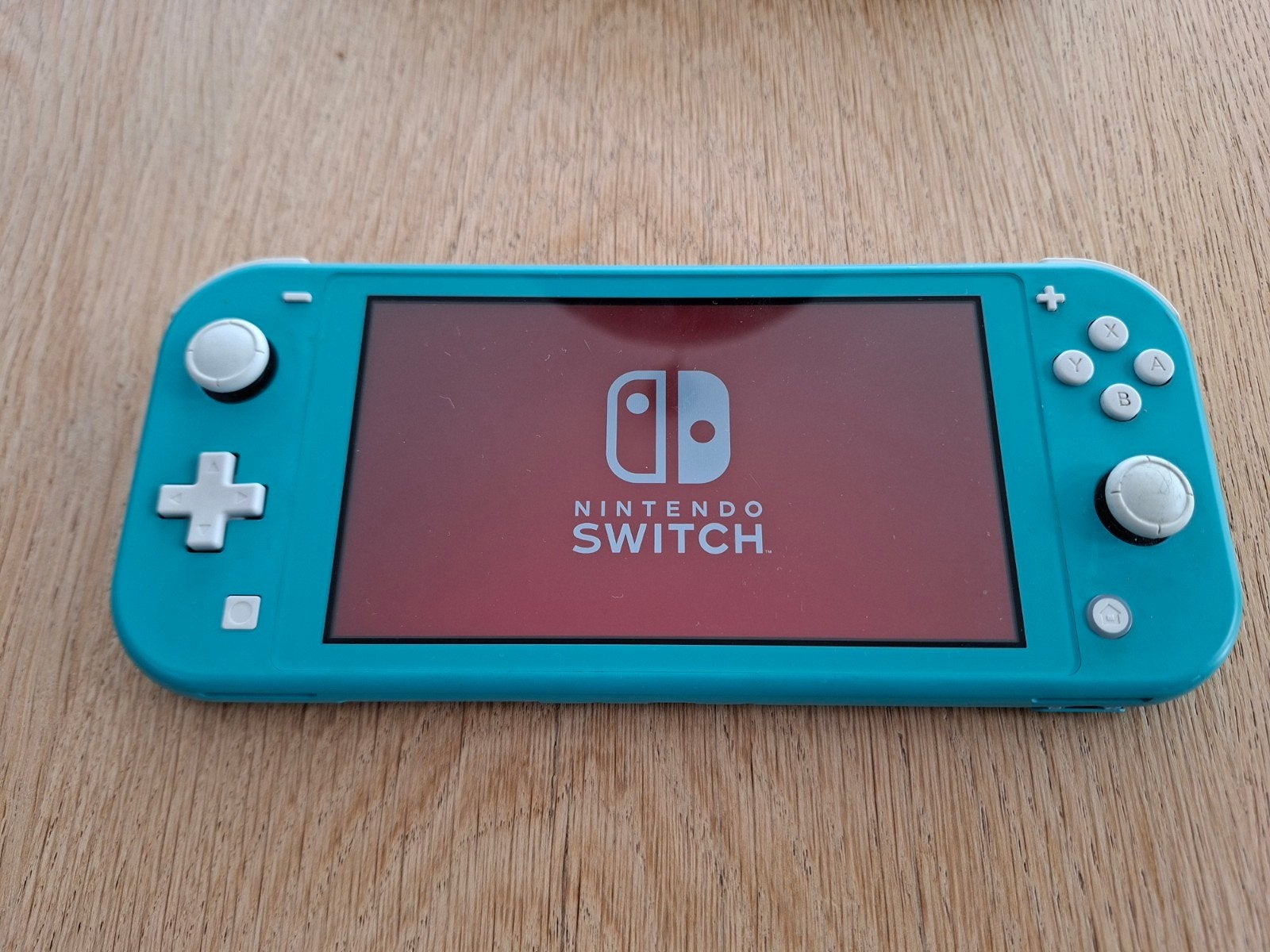 Nintendo Switch Lite Turquoise met hoesje en boekjes, Ophalen of Verzenden, Zo goed als nieuw, Zonder controller, Switch Original