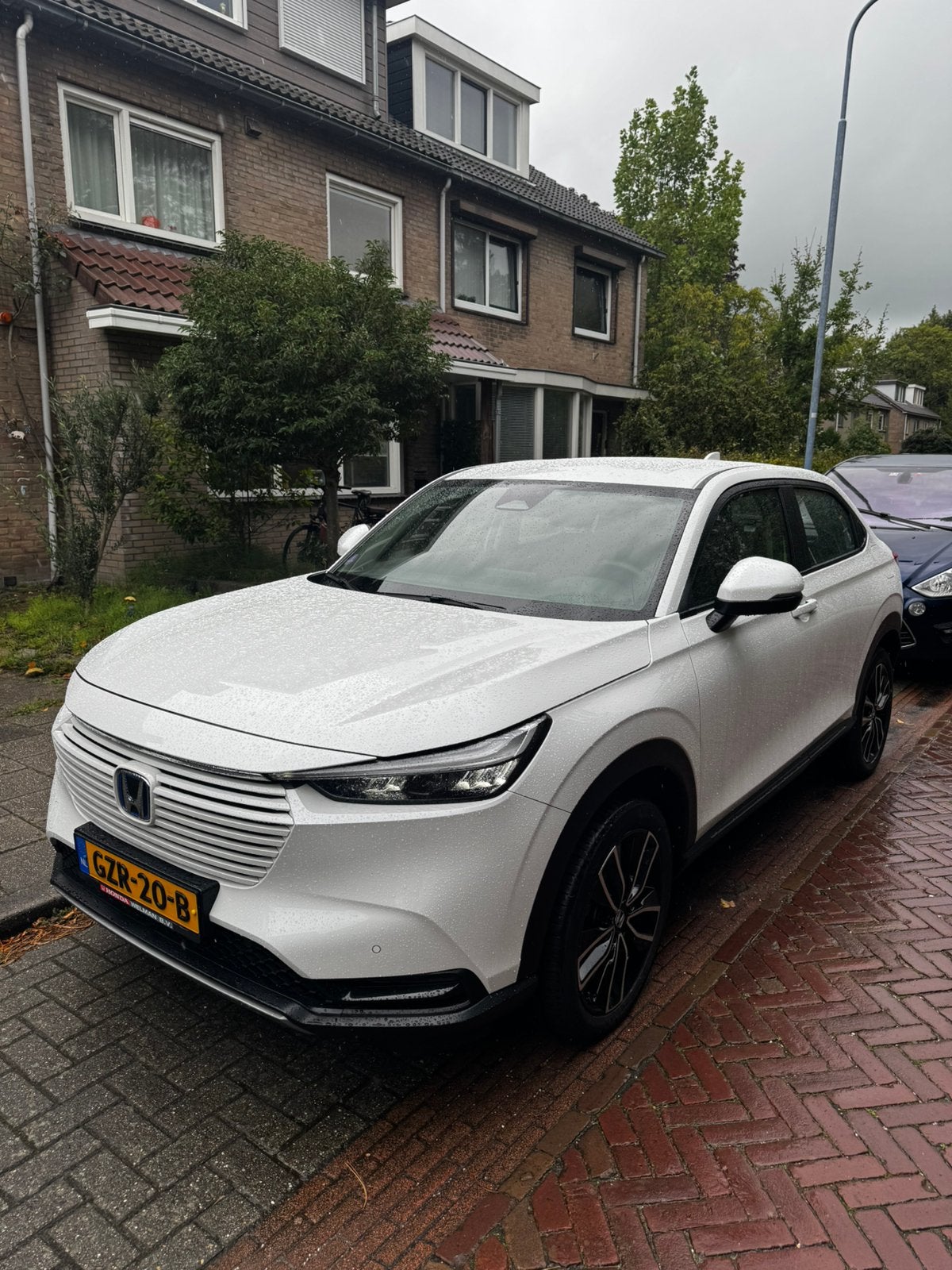 Honda HR-V 1.5 e:HEV Elegance 2025 Garantie 2032 | dealer o., Auto's, Dealer onderhouden, 1498 cc, Leder en Stof, Wit