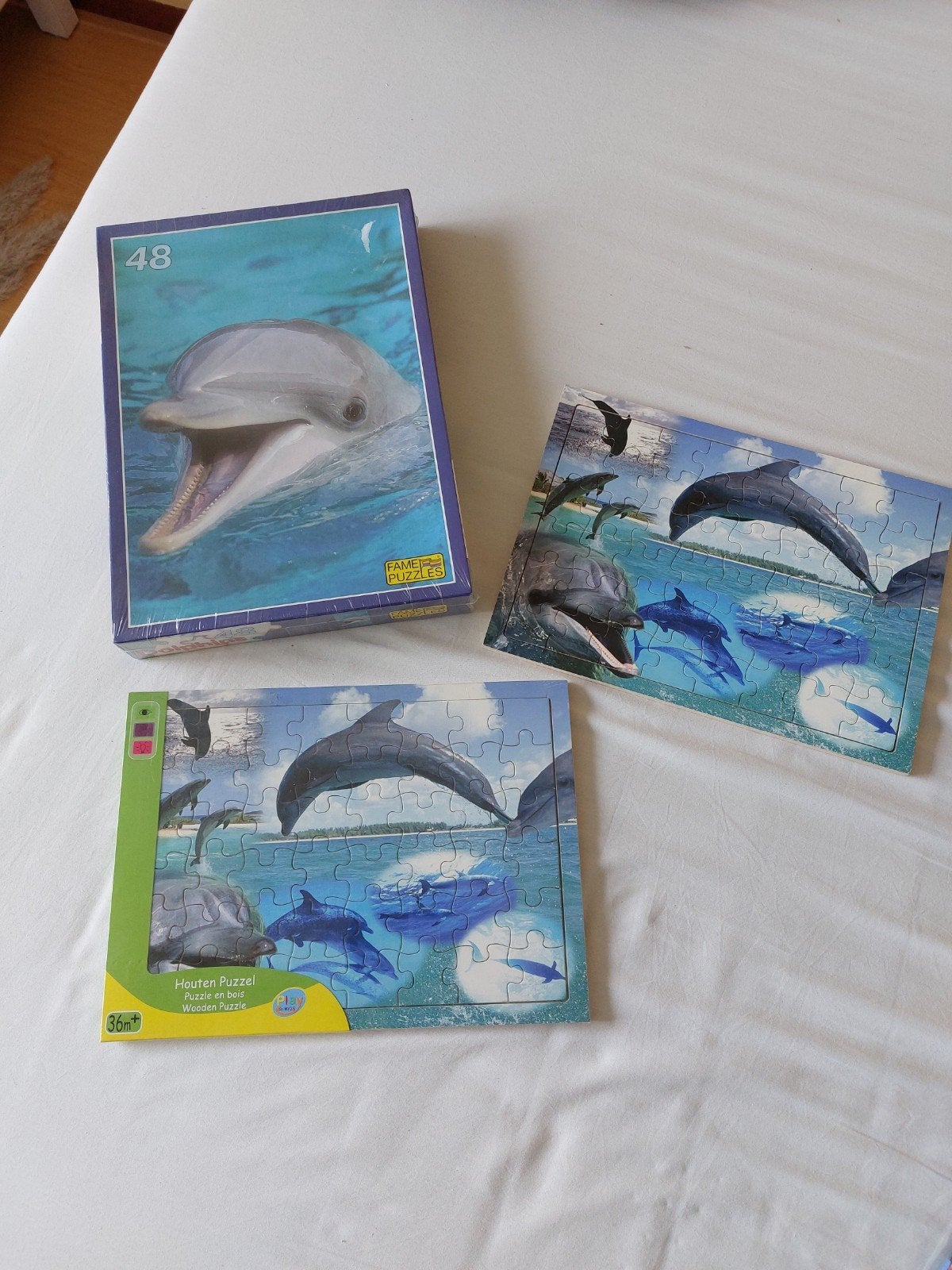 Dolfijnpuzzels, bordjes, lamp, kalender, speelgoed, Ophalen of Verzenden, Zo goed als nieuw, Overige typen