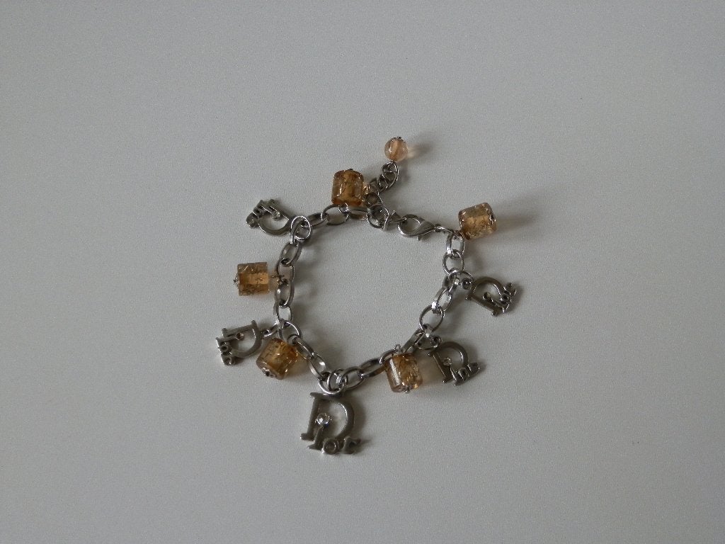Christian Dior . Dior armband . Bedel Steen., Overige materialen, Ophalen of Verzenden, Zo goed als nieuw, Met bedels of kralen