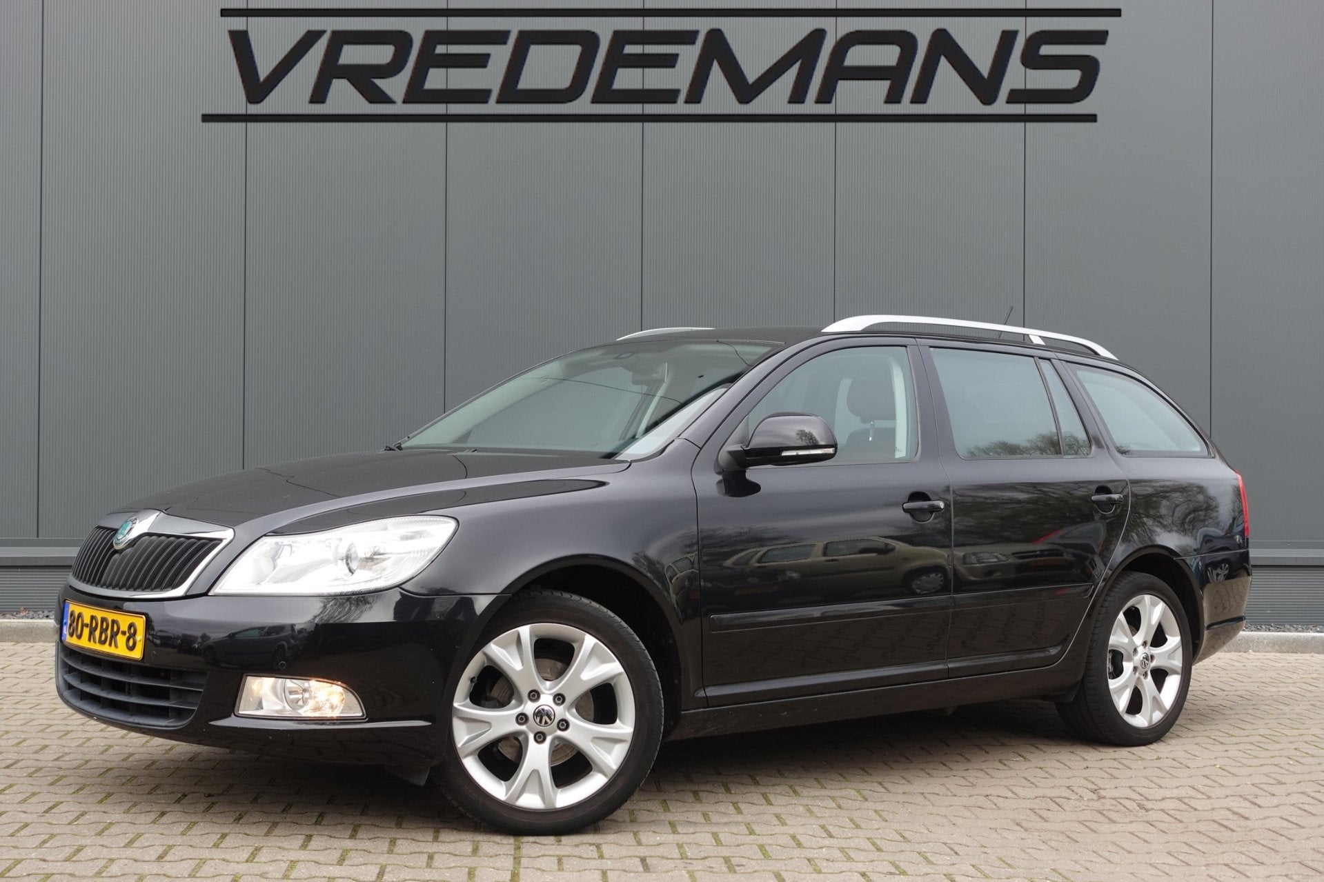 Skoda Octavia Combi 1.2 TSI Elegance AUTOMAAT/NAVI/LEDER, Auto's, Skoda, Euro 5, Gebruikt, 4 cilinders, Zwart