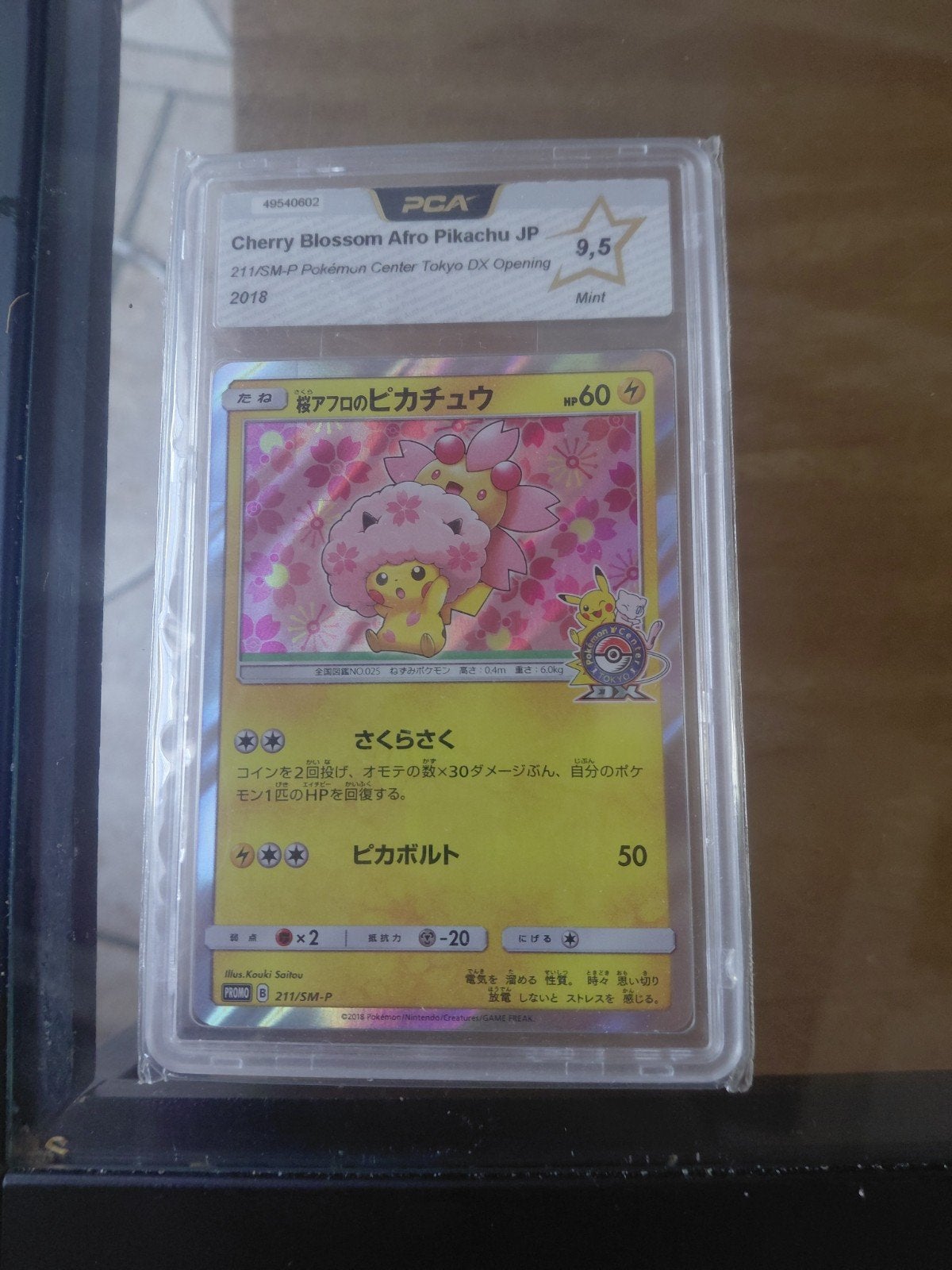 PCA 9.5 Cherry Blossom Afro Pikachu JP 2018 Pokémon Kaart, Ophalen, Zo goed als nieuw, Losse kaart, Foil