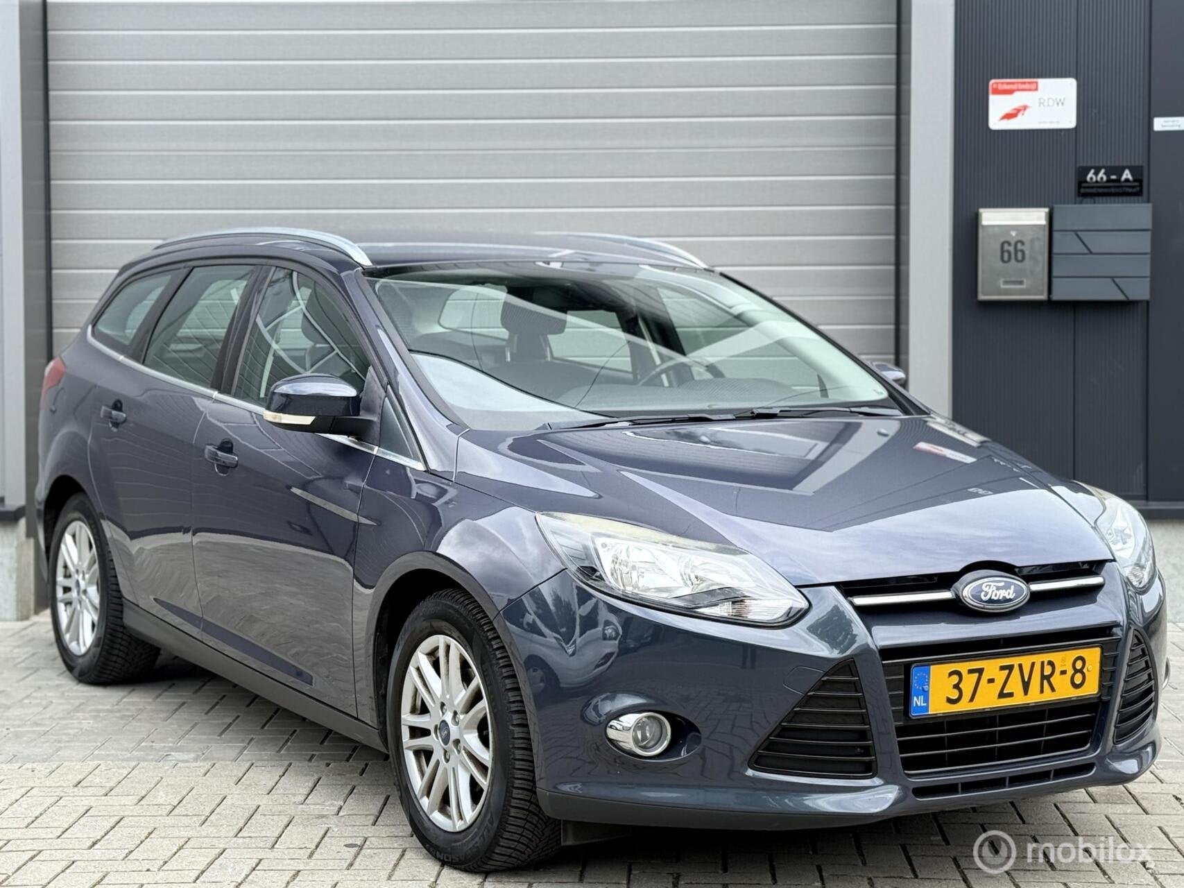 Ford Focus Wagon 1.0 EcoBoost Titanium Garantie !, Auto's, Euro 5, 125 pk, Gebruikt, Handgeschakeld