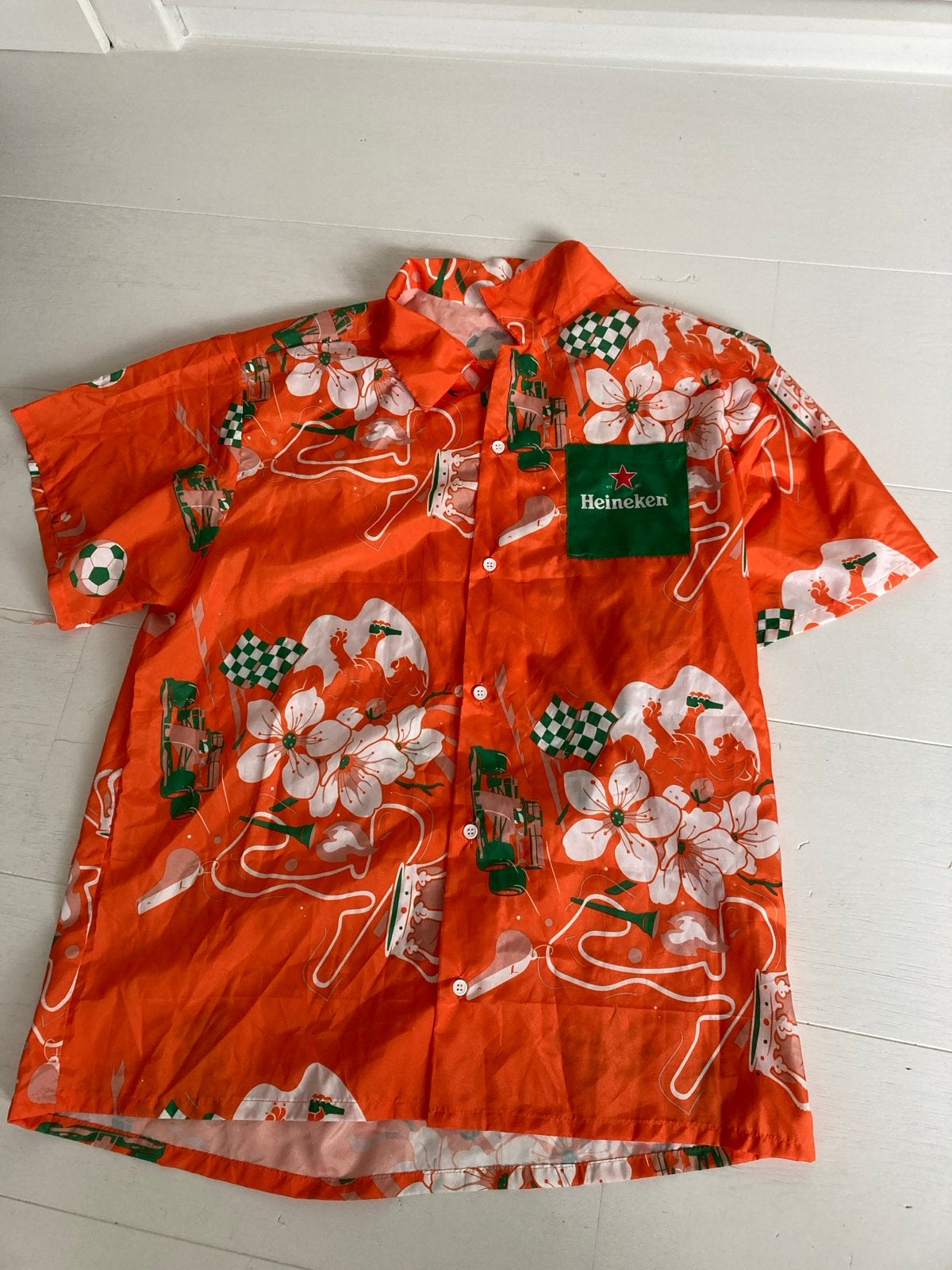 Heineken Hawaï oranje shirt L/XL, Verzamelen, Biermerken, Ophalen of Verzenden, Gebruikt, Kleding, Heineken