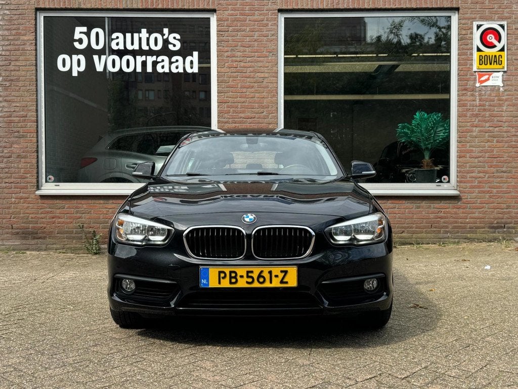 BMW 1-serie 118i Corporate Lease | Navi | Automaat | Cruise, Auto's, BMW, 12 maanden, Gebruikt, Zwart, Bedrijf