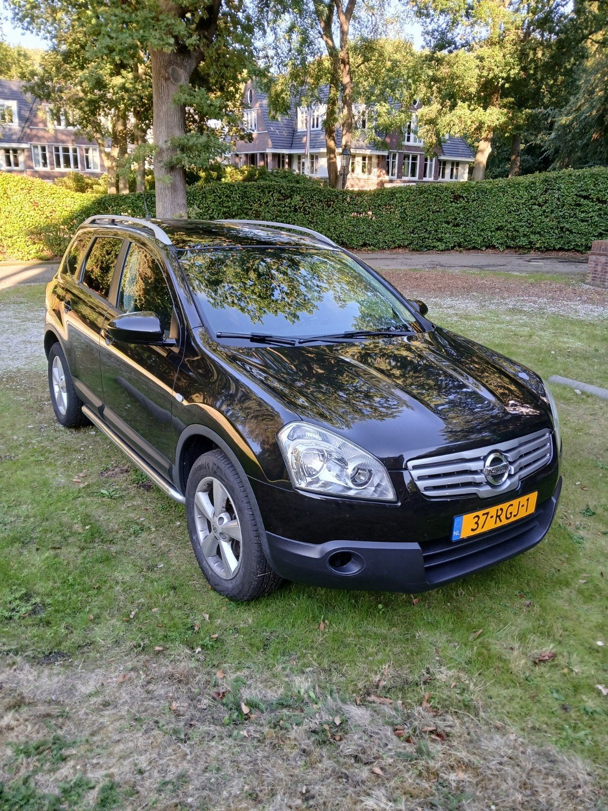 Nissan Qashqai+2 1.6 2WD 2009 Zwart, Auto's, Voorwielaandrijving, Stof, 4 cilinders, 7 stoelen