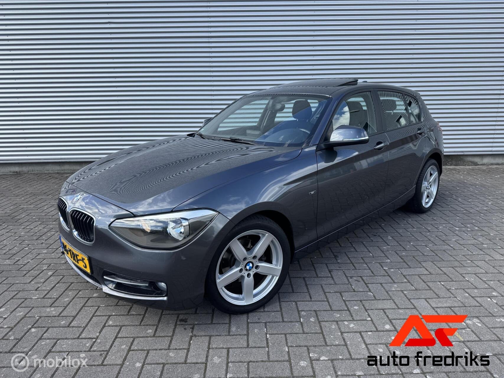 BMW 1-serie 116i Business+ Sport | Panorama dak | Navigatie, Auto's, BMW, 1-Serie, Euro 5, Gebruikt, 4 cilinders