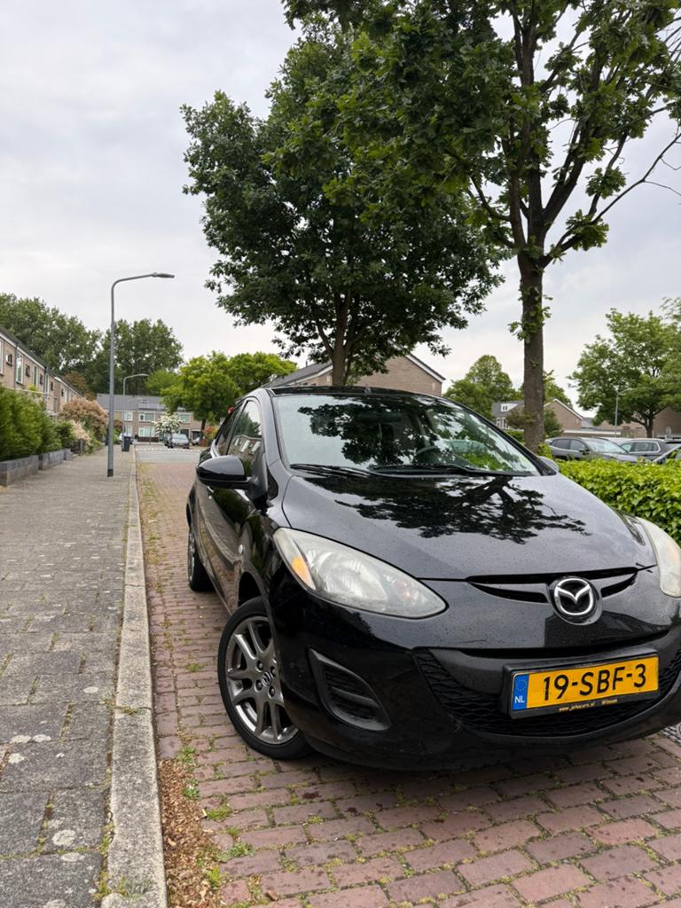 Mazda 2 1.3 Bifuel 75pk 5D 2011 Zwart, Auto's, Voorwielaandrijving, 74 pk, 4 cilinders, Zwart