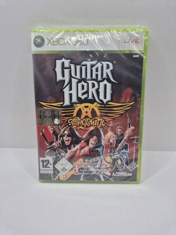 Guitar Hero Aerosmith Xbox 360 NIEUW!, Microsoft Corporation One Microsoft Way Redmond, WA 98052-6399 United States of America (Verenigde Staten) 📞 Telefoon: +1 425-882-8080 support@microsoft.com