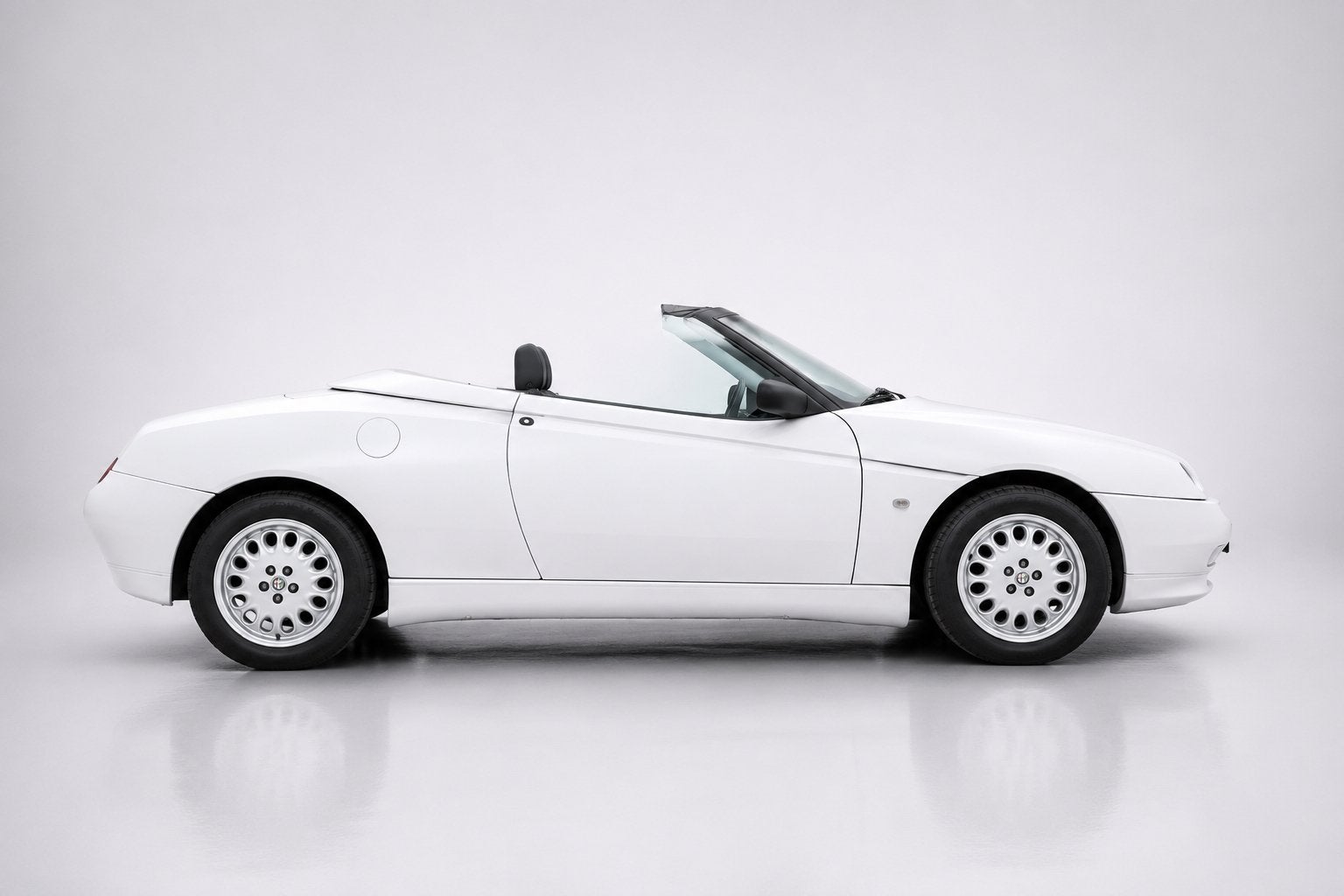 Alfa Romeo Spider 2.0 Twin Spark 16V 1997 Wit, Auto's, Alfa Romeo, Voorwielaandrijving, Lederen bekleding, Zwart, Spider