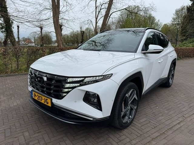 Hyundai Tucson 1.6T-GDI 180PK PHEV Premium Sky/Trekhaak/Pano, Auto's, Automaat, 1350 kg, Gebruikt, Euro 6