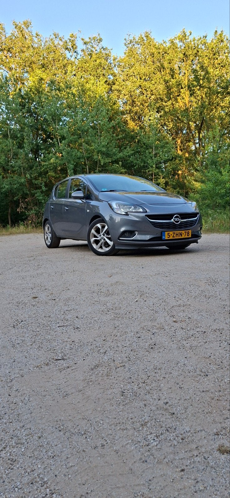 Opel Corsa 1.0T 66KW/90PK 5D 2015 Grijs, Auto's, Voorwielaandrijving, Stof, Origineel Nederlands, Handgeschakeld