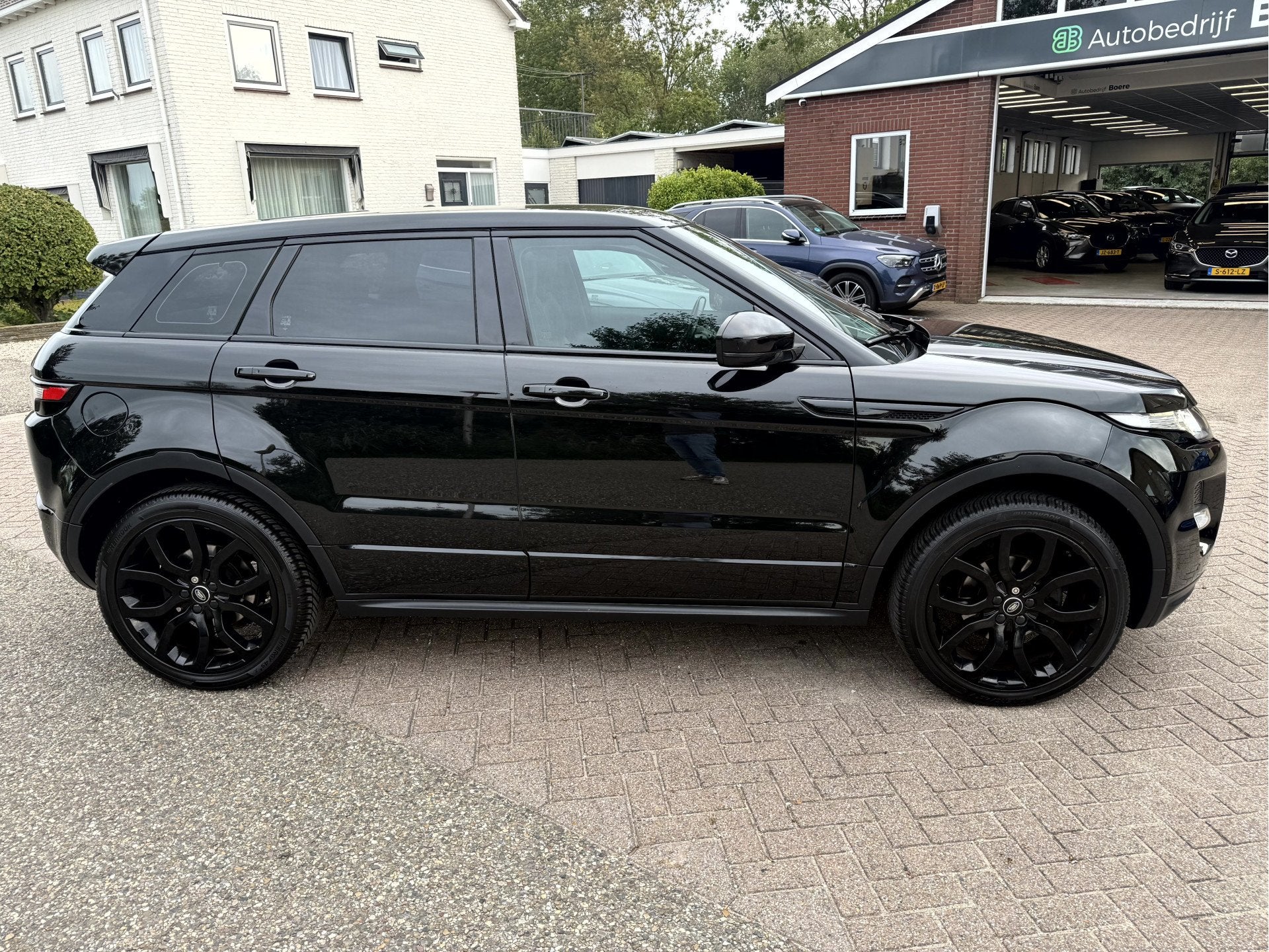 Land Rover Range Rover Evoque 2.0 Si 240pk 4WD Prestige Leer, Euro 5, Zwart, 4 cilinders, Zwart