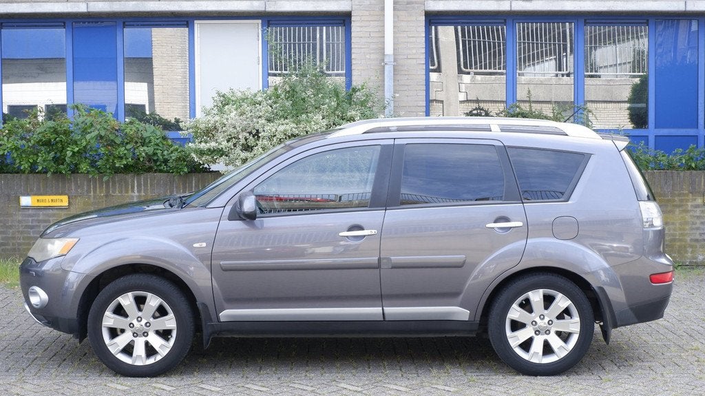 Mitsubishi Outlander 2.2 DI-D Instyle 7 - ZITS, Auto's, Mitsubishi, Zwart, 2000 kg, 7 stoelen, Bedrijf