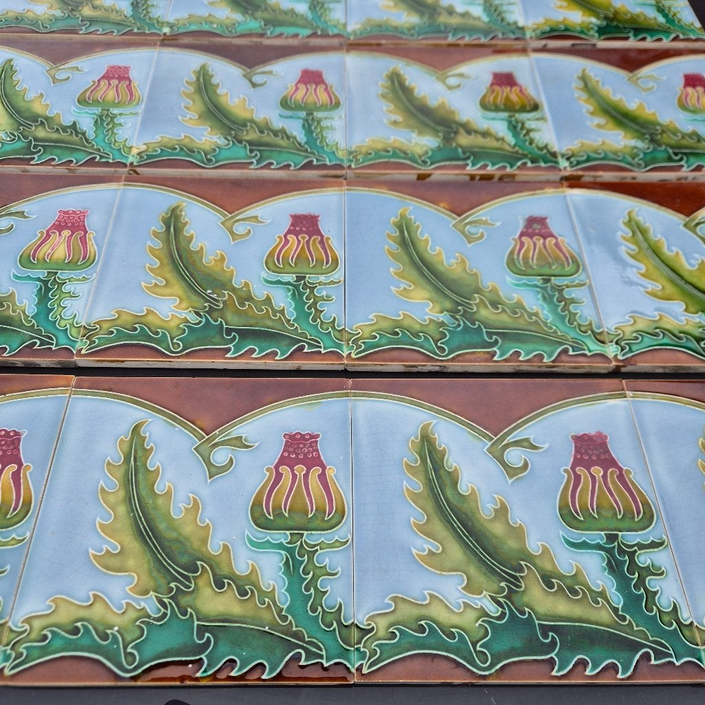 16 art nouveau wandtegels distel, blauwe achtergrond