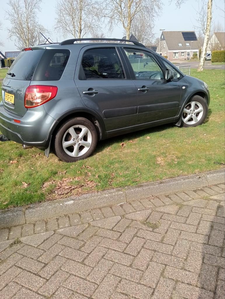 Suzuki SX4 1.6 2008 Grijs, Auto's, Suzuki, Zwart, 4 cilinders, 49 €/maand, Origineel Nederlands
