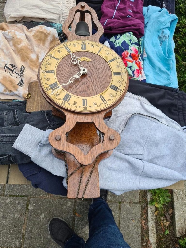Warmink wuba wandklok, Ophalen