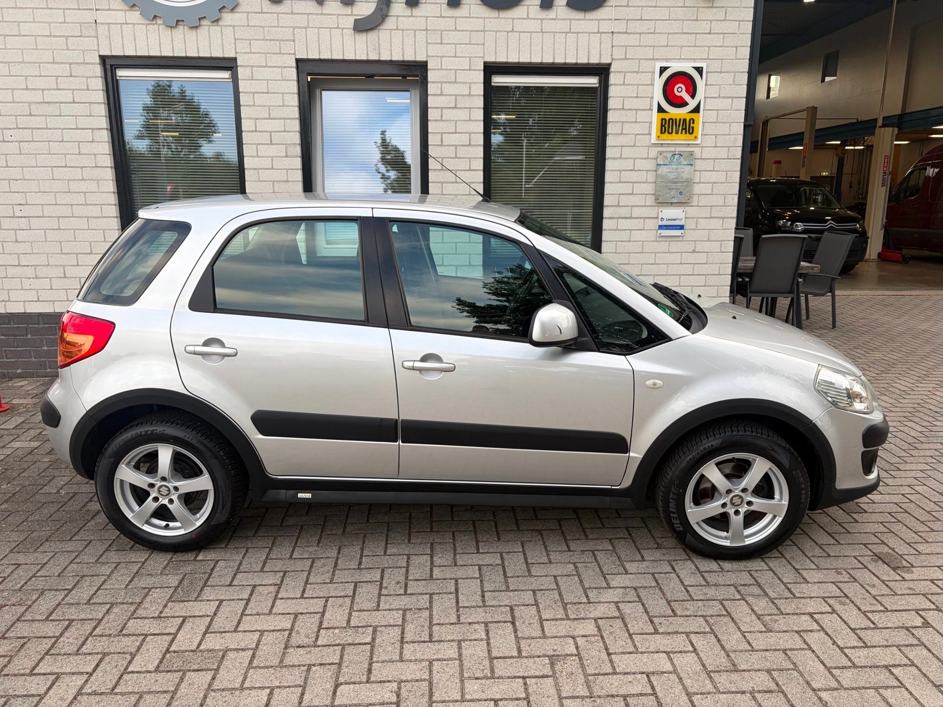Suzuki SX4 1.6 Comfort / Centrale vergrendeling / Airco / Tr, Auto's, Voorwielaandrijving, Gebruikt, Zwart, 4 cilinders